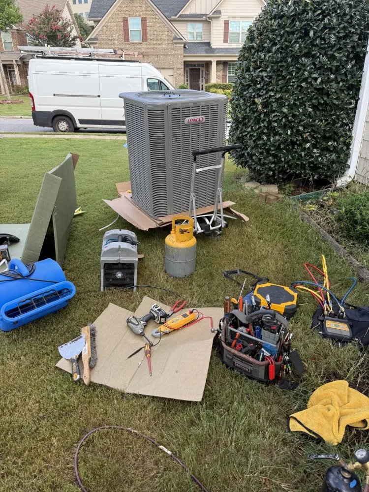 Outdoor HVAC installation work at an Atlanta home